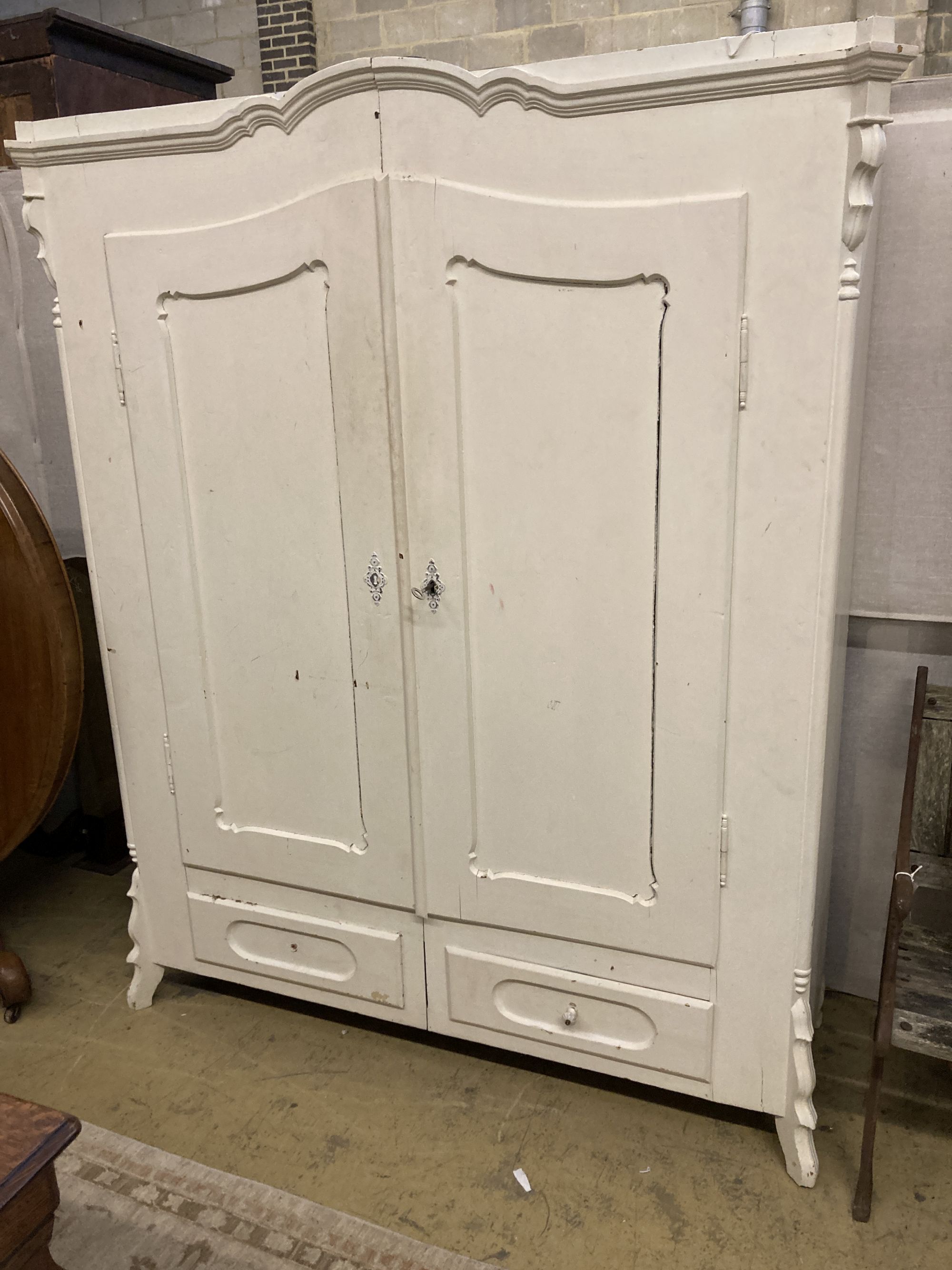 A 19th century Continental painted pine two door wardrobe, width 150cm depth 52cm height 179cm